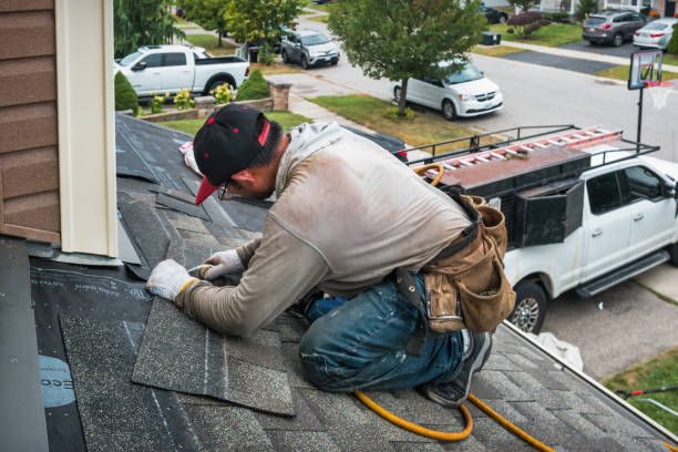 Professional Hail Damage Roof Repair technician working in Milton, MA